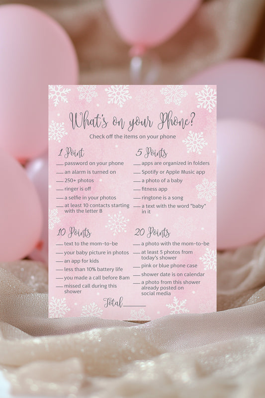 Pink baby shower game card with balloons in the background